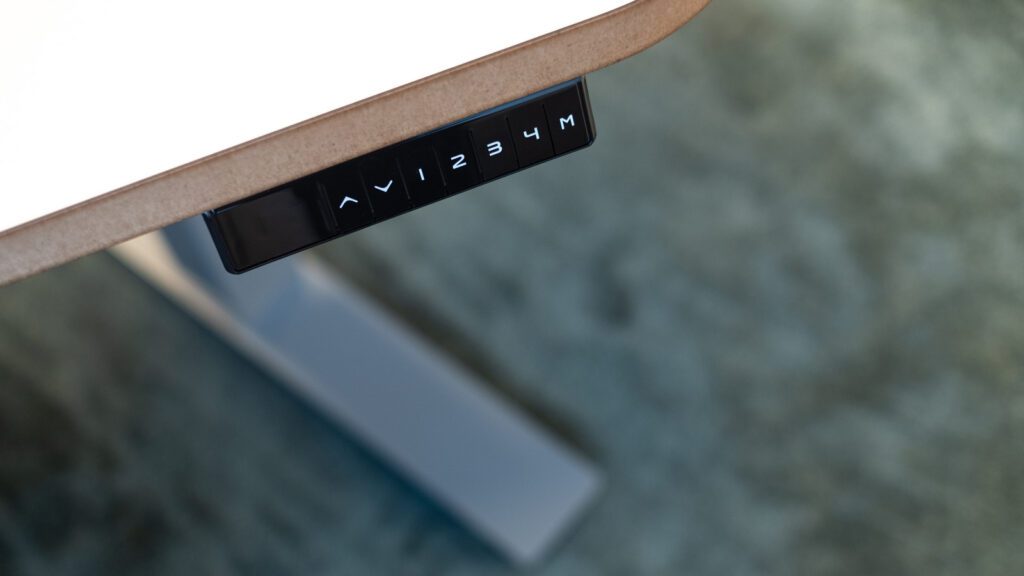 A view of the settings buttons for a standing desk.
