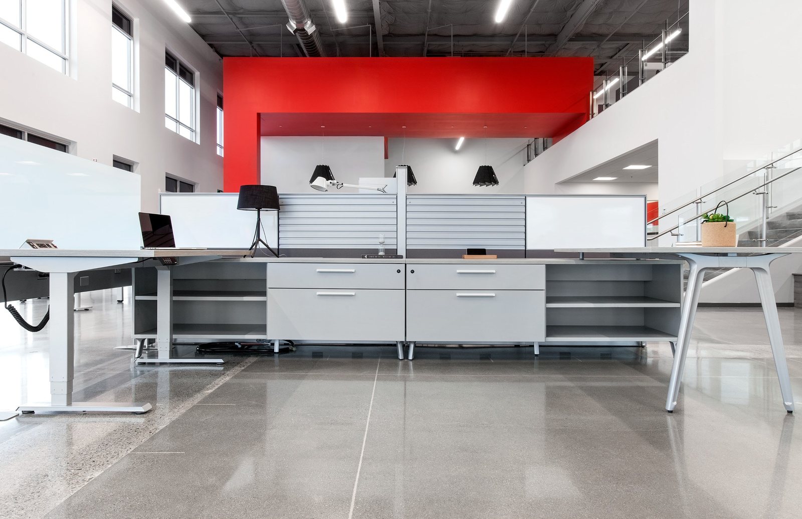 Friant open-plan workstations with height-adjustable desks and storage