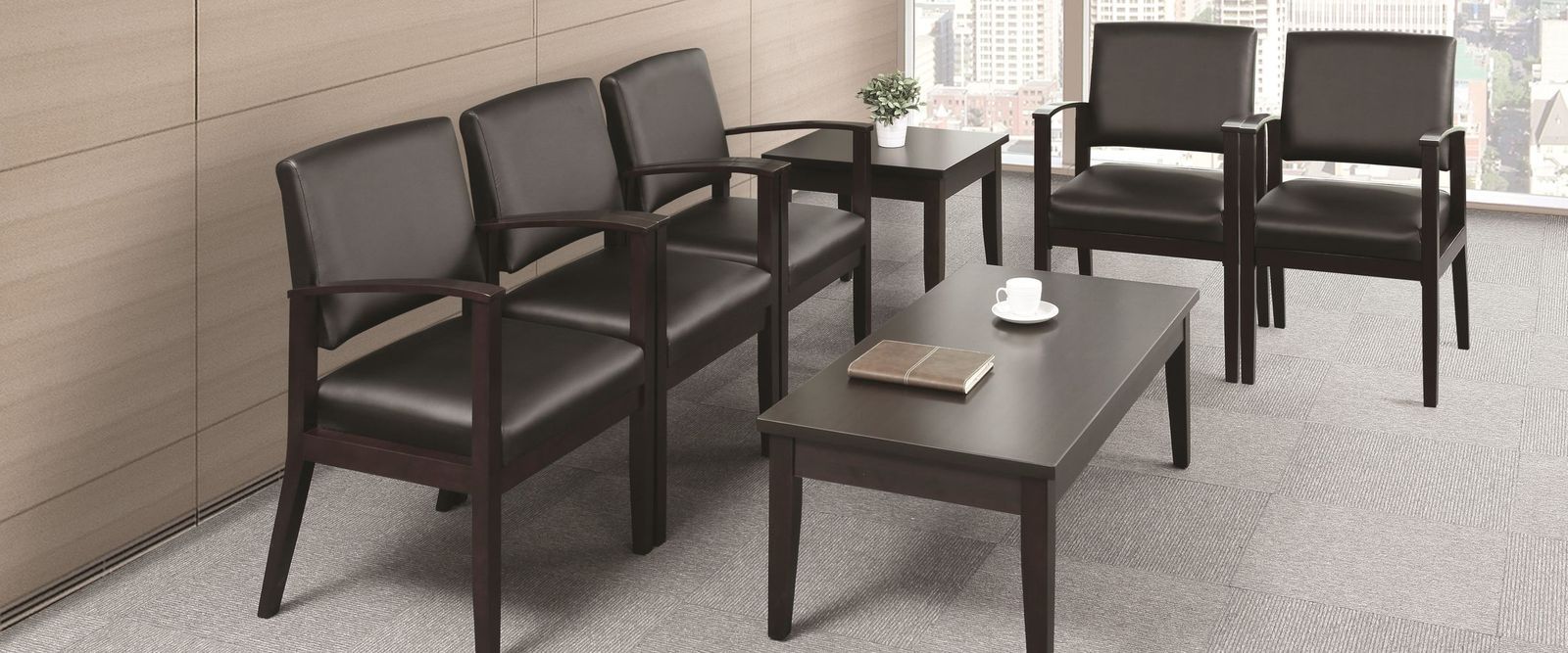 Dealership customer lounge with guest chairs and side tables