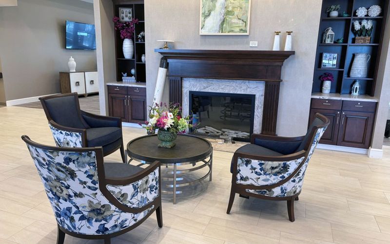 Lounge seating and fireplace at the Foundations Health facility furnished by Capital Choice