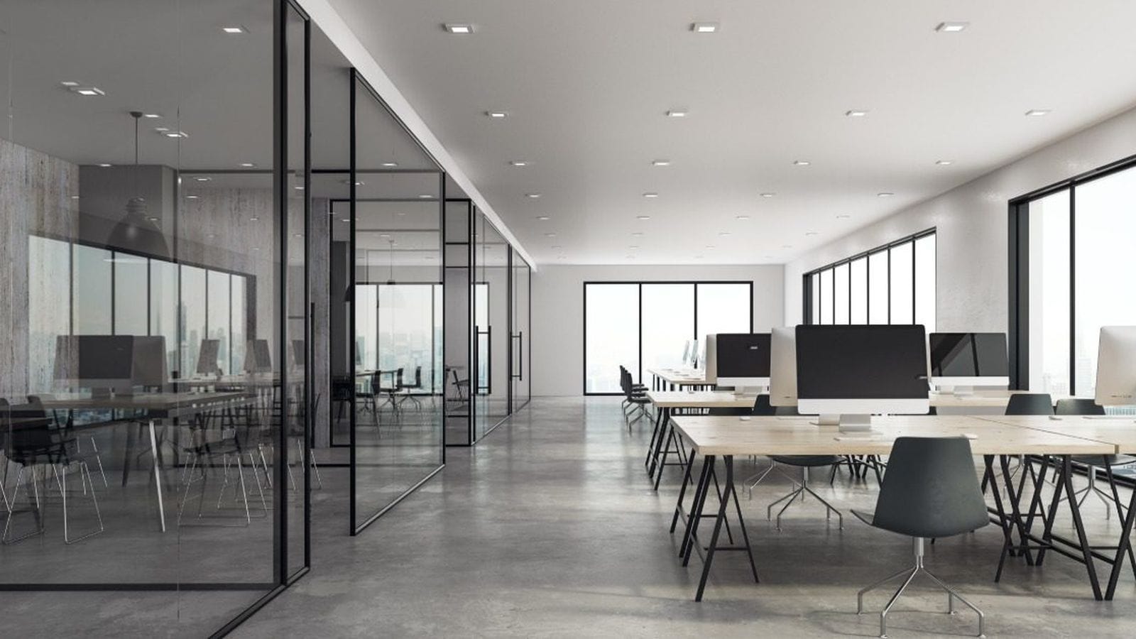 Modern glass-walled office space with sit-stand desks designed for a business relocation