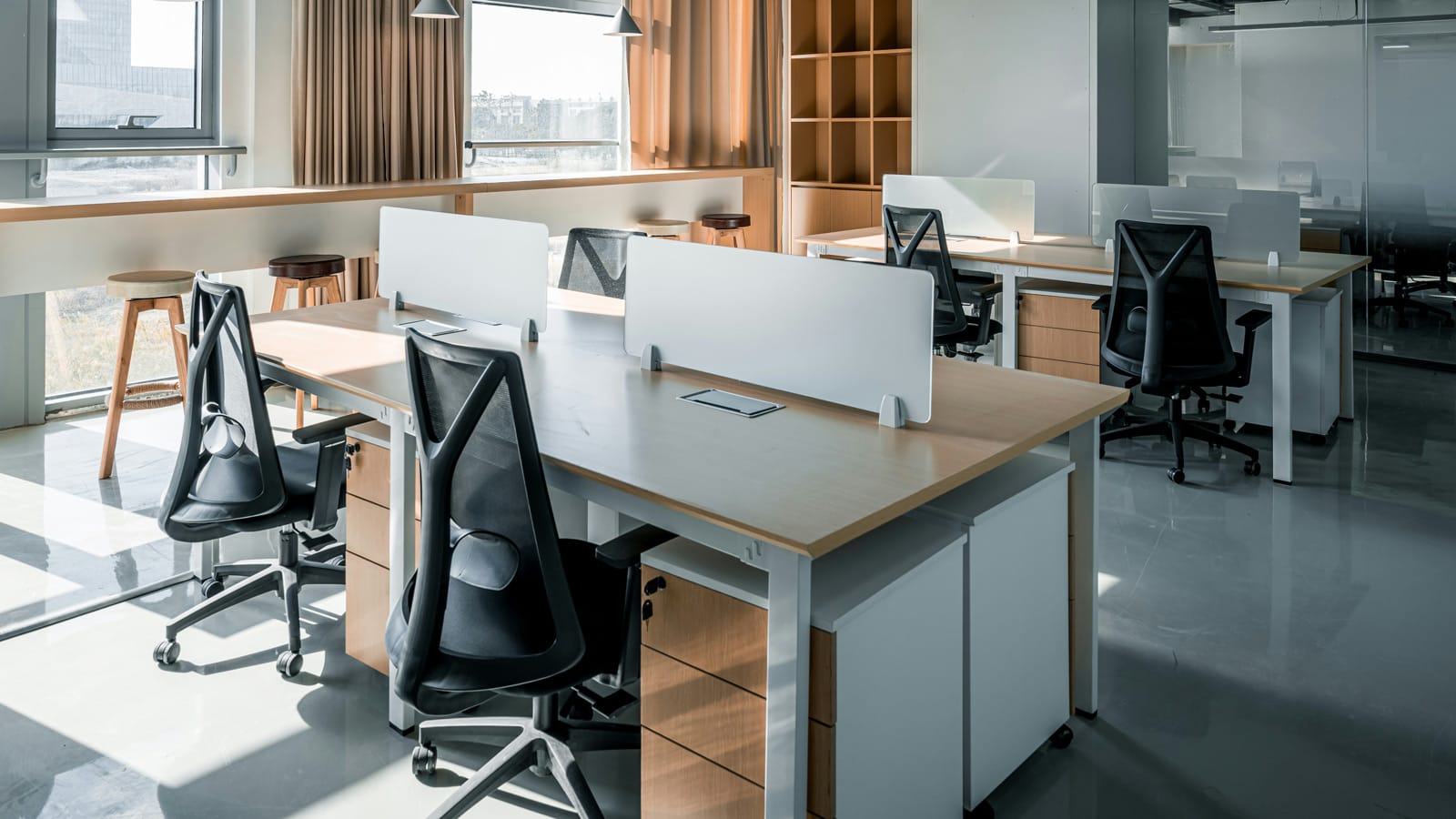 Modern open office workspace with flexible desks and greenery designed for growth