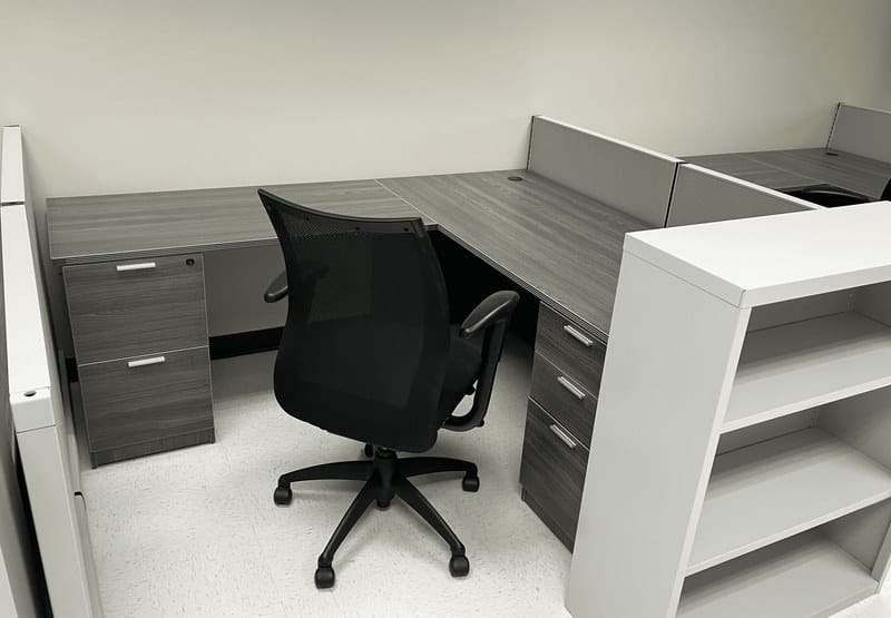 Low-wall cubicle with L-shaped desk and task chair at THK Manufacturing of America in Hebron, Ohio