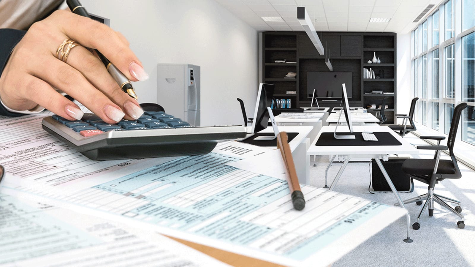 Business owner calculating year-end tax deductions on office furniture purchases