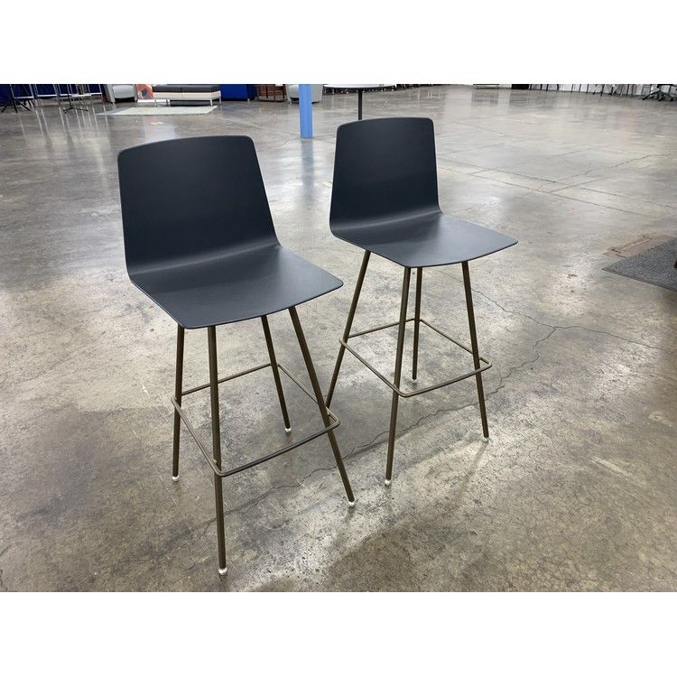 Pre-owned navy armless stools with brass legs, front view