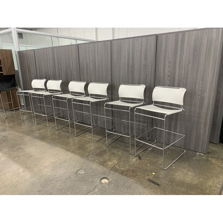 Pre-owned Harter white stools with chrome sled bases, front view