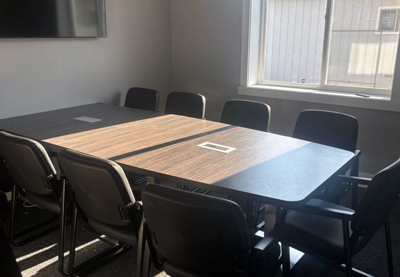 Boat-shaped conference table with task chairs at Singleton Construction in Lancaster, Ohio