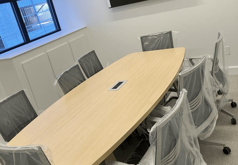 Conference room table with executive task chairs at Luxe Redux Bridal in Columbus, Ohio