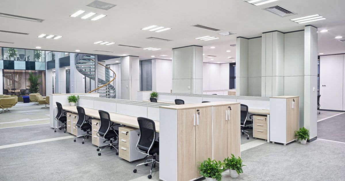 Open office with rows of workstations, desks, and task chairs ready for a phased furniture upgrade