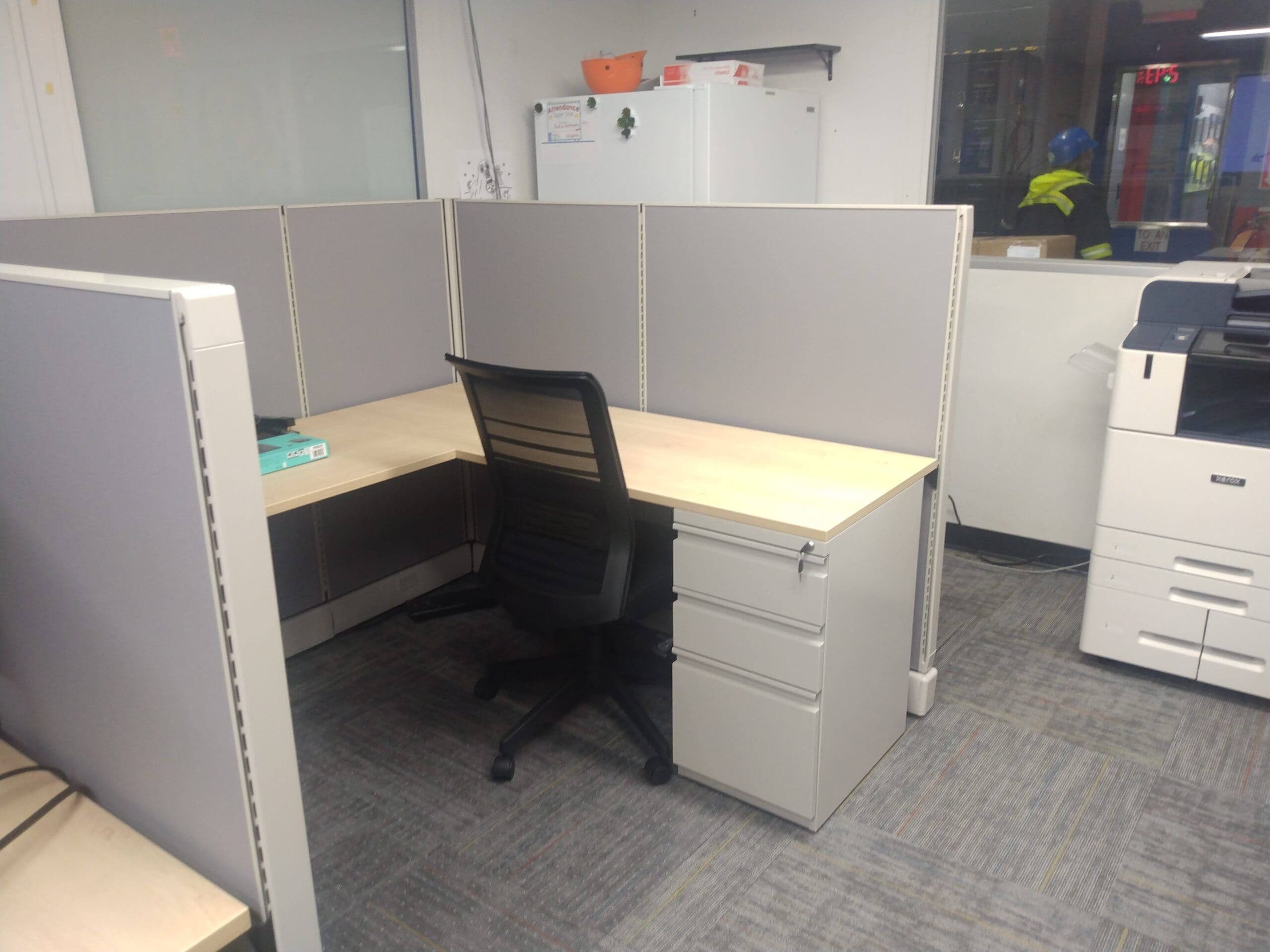 6x6 grey cubicle workstation mid height with a white drawer system and a black chair
